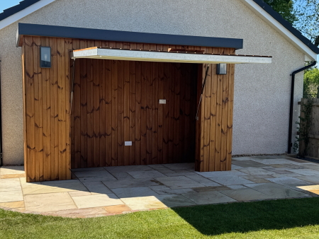 Outdoor Kitchen clad in Thermowood with hinged door