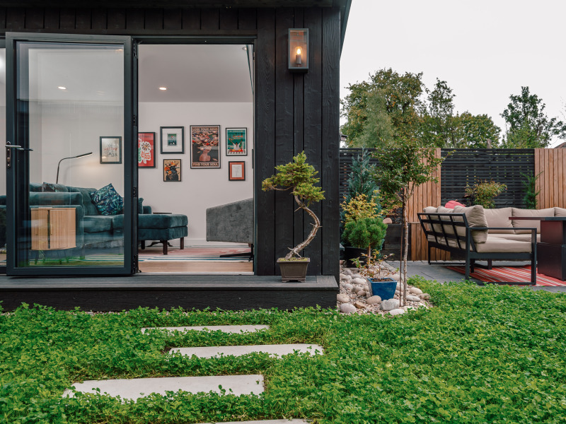 Garden Room clad in black timber with clover lawn